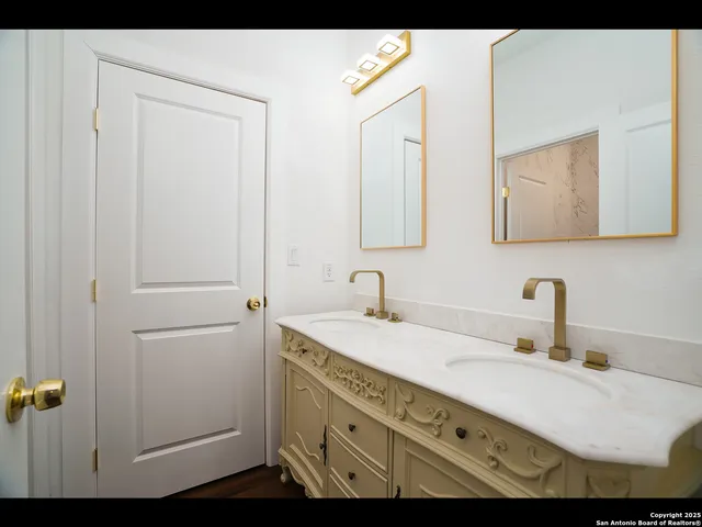 a bathroom with a sink and mirror