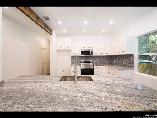a view of kitchen with wooden floor