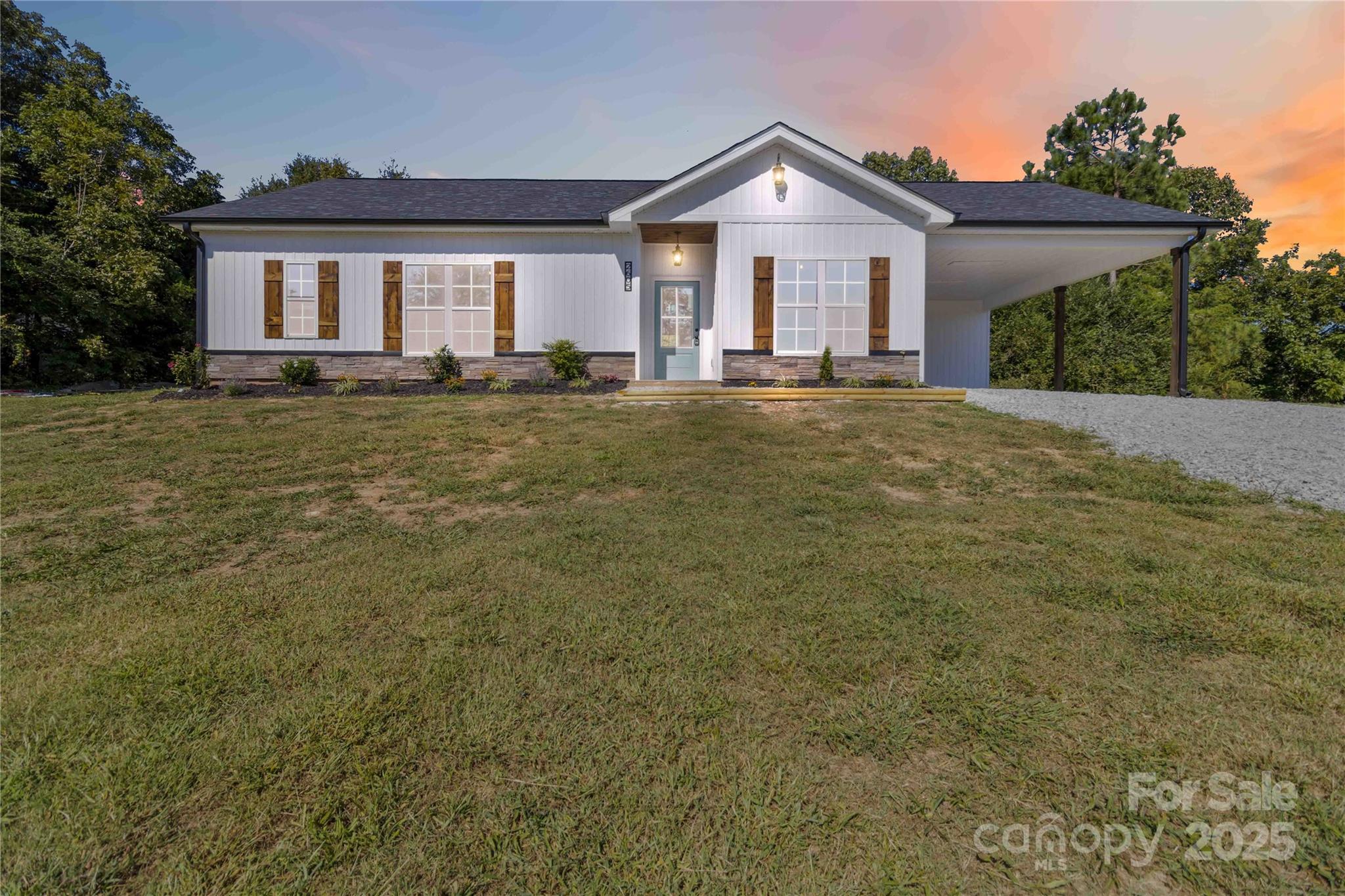 2605 Mt Prospect Road Chester, SC 29706 - Photo 1 of 31 a front view of a house with a yard and garage
