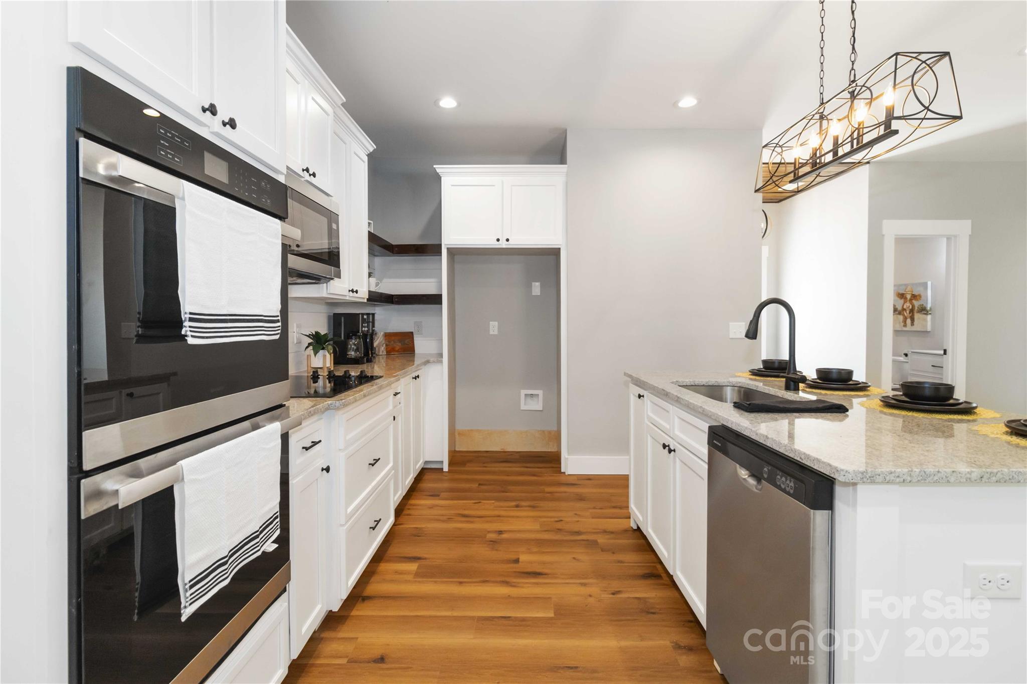 2605 Mt Prospect Road Chester, SC 29706 - Photo 13 of 31 a large kitchen with stainless steel appliances granite countertop a sink and cabinets