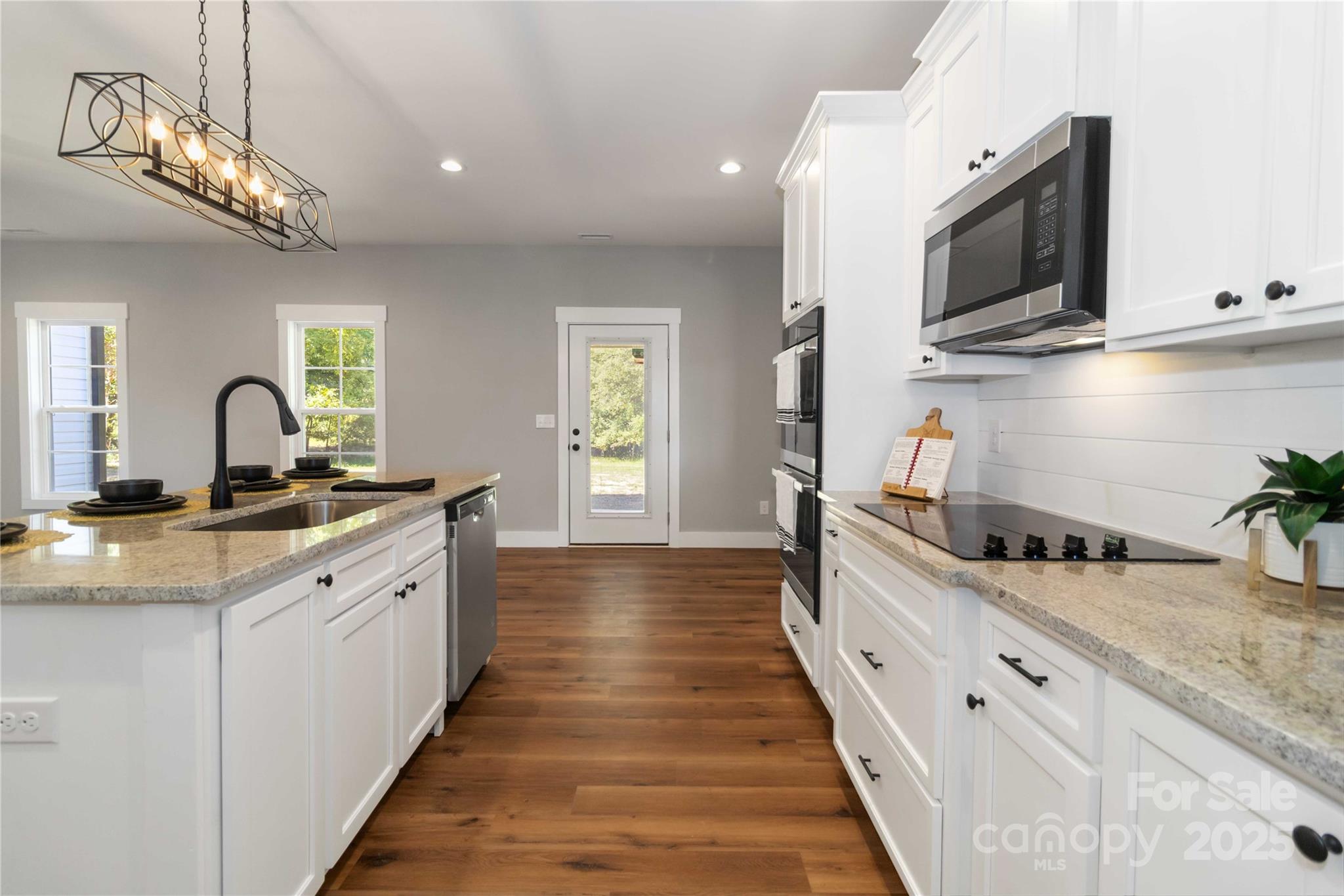 2605 Mt Prospect Road Chester, SC 29706 - Photo 14 of 31 a kitchen with stainless steel appliances a sink stove and cabinets