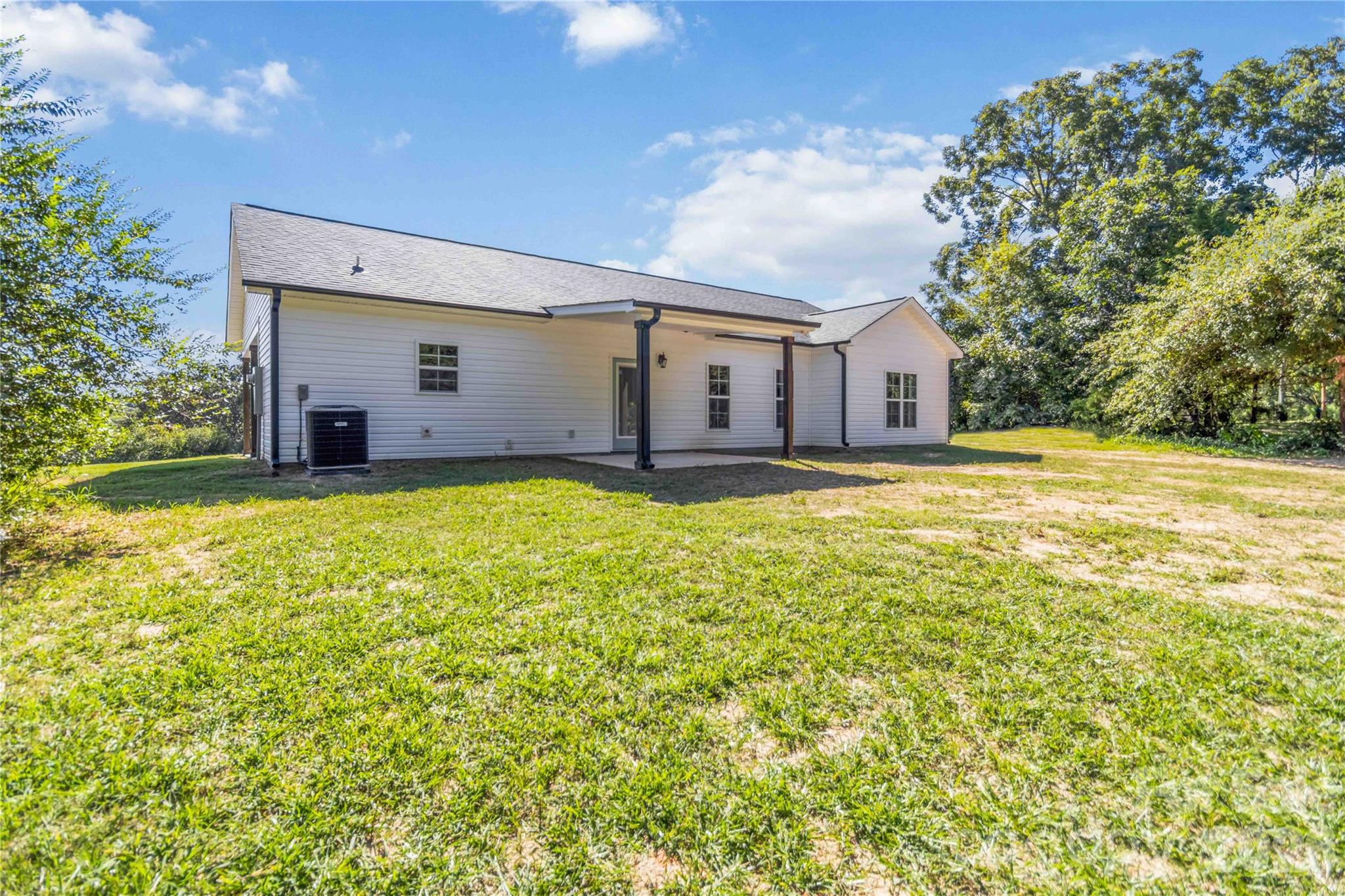 2605 Mt Prospect Road Chester, SC 29706 - Photo 25 of 31 a large house with a big yard and large trees