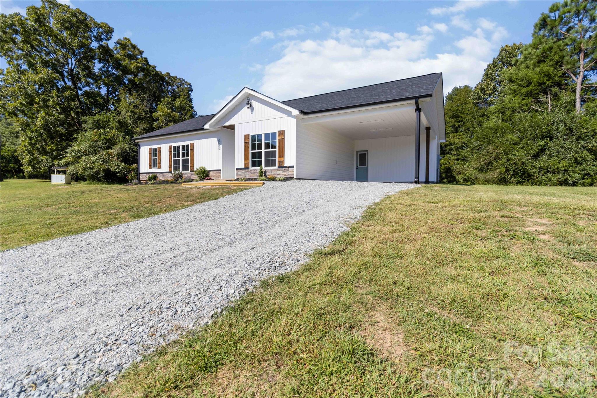 2605 Mt Prospect Road Chester, SC 29706 - Photo 30 of 31 a view of a house with a yard and garage