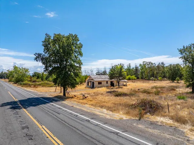 a view of a swimming pool with an outdoor seating