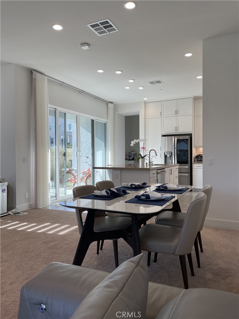 203 Novel Irvine, CA 92618 - Photo 4 of 24 a view of a dining room with furniture
