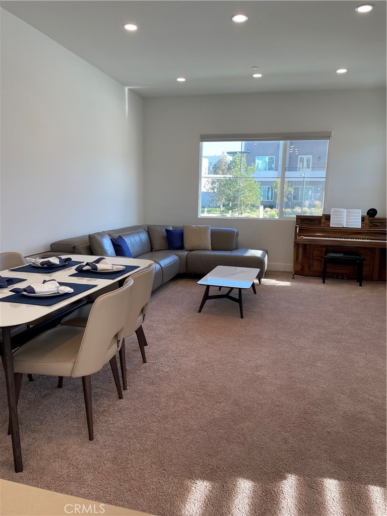 203 Novel Irvine, CA 92618 - Photo 8 of 24 a living room with furniture and a large window