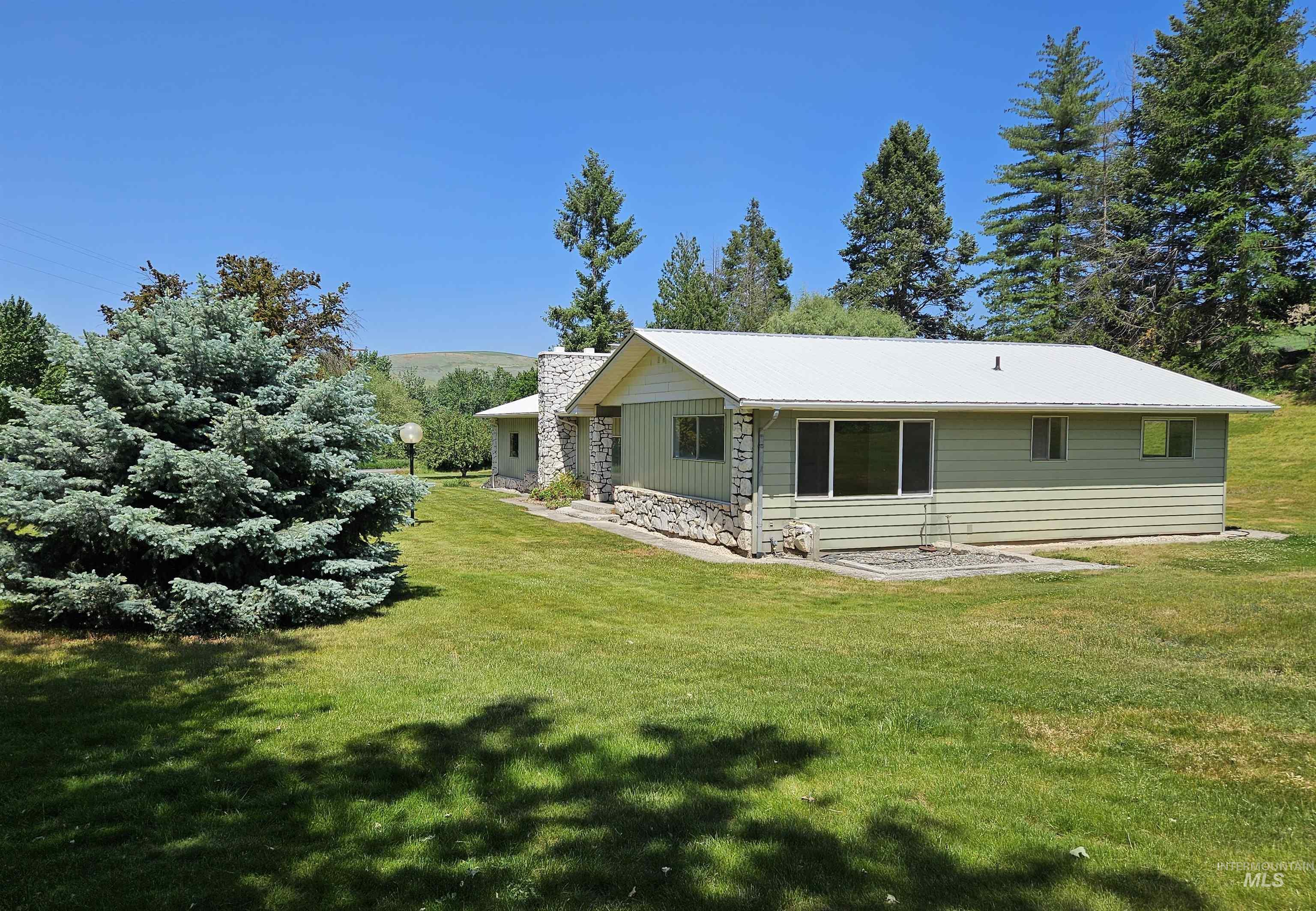 29865 Mission Creek Road Culdesac, ID 83524 - Photo 40 of 43 Ranch-style residence featuring light green siding and a white metal roof