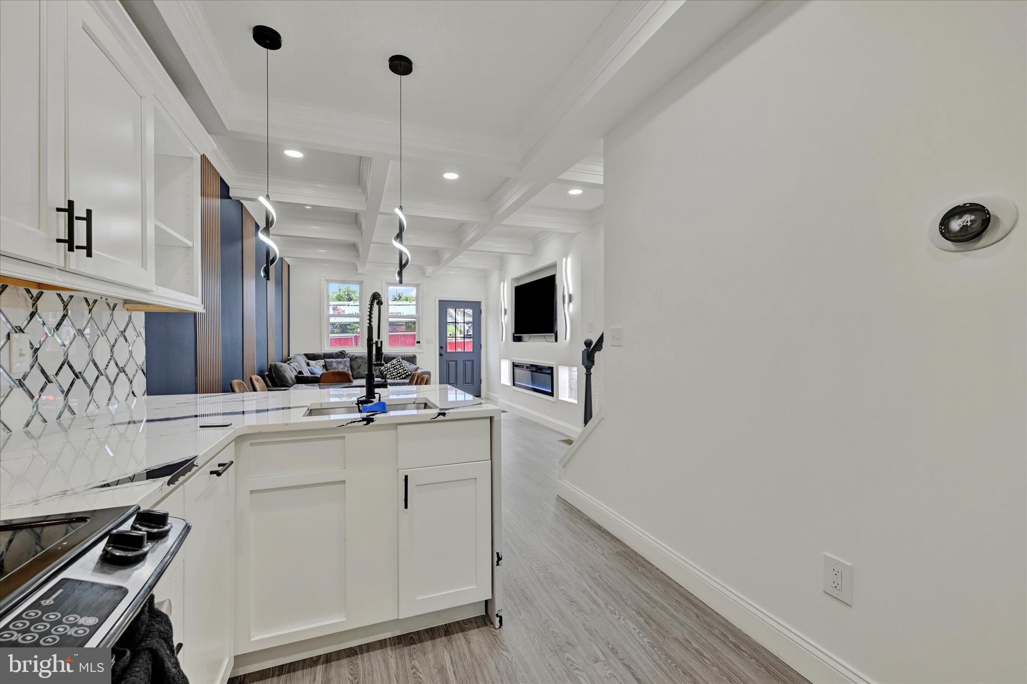 1748 North Chester Street Baltimore, MD 21213 - Photo 11 of 27 a kitchen with a sink appliances and cabinets