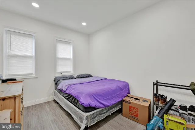 a bedroom with a bed and a tv