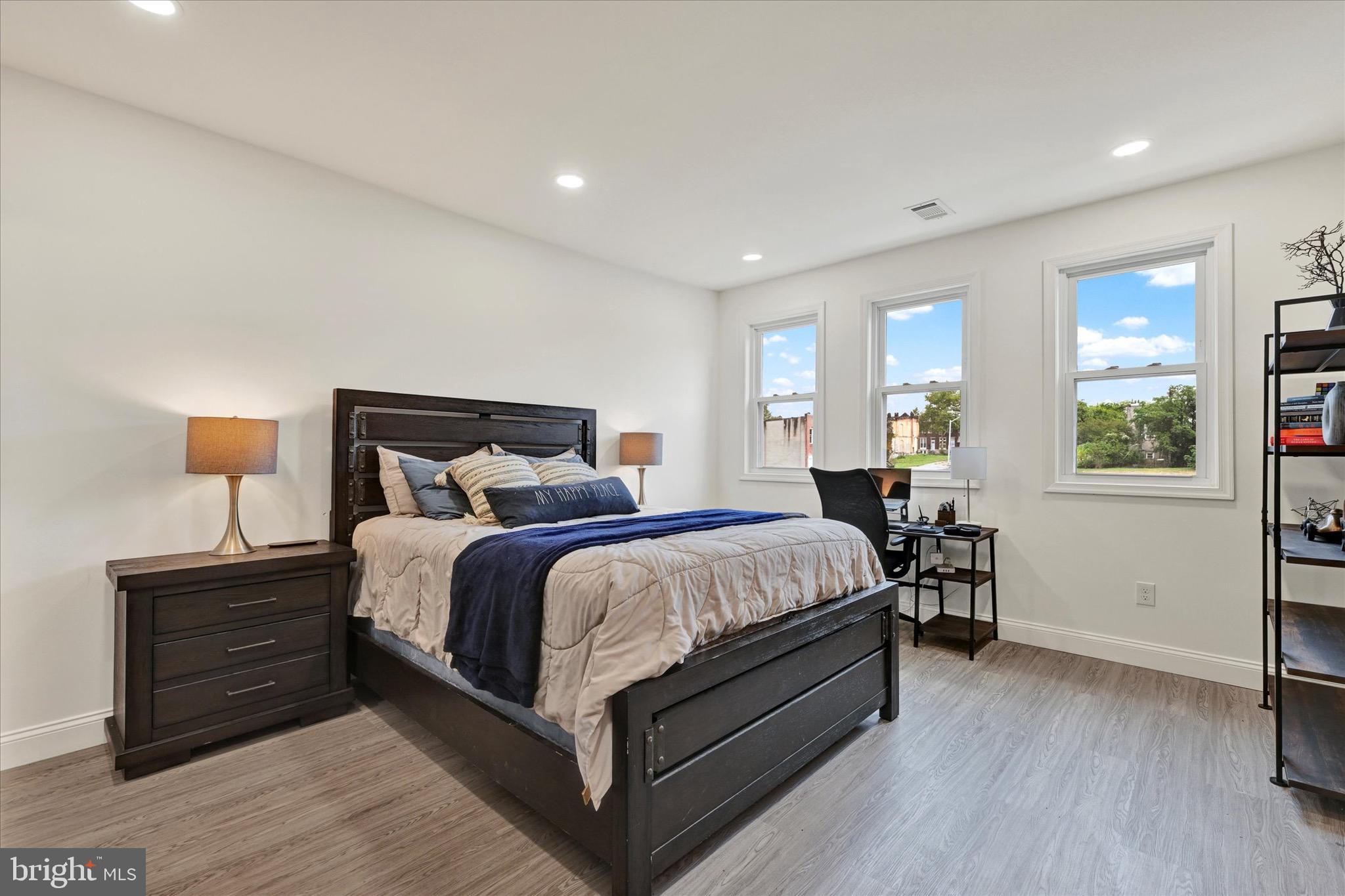 1748 North Chester Street Baltimore, MD 21213 - Photo 17 of 27 a bedroom with a bed and window