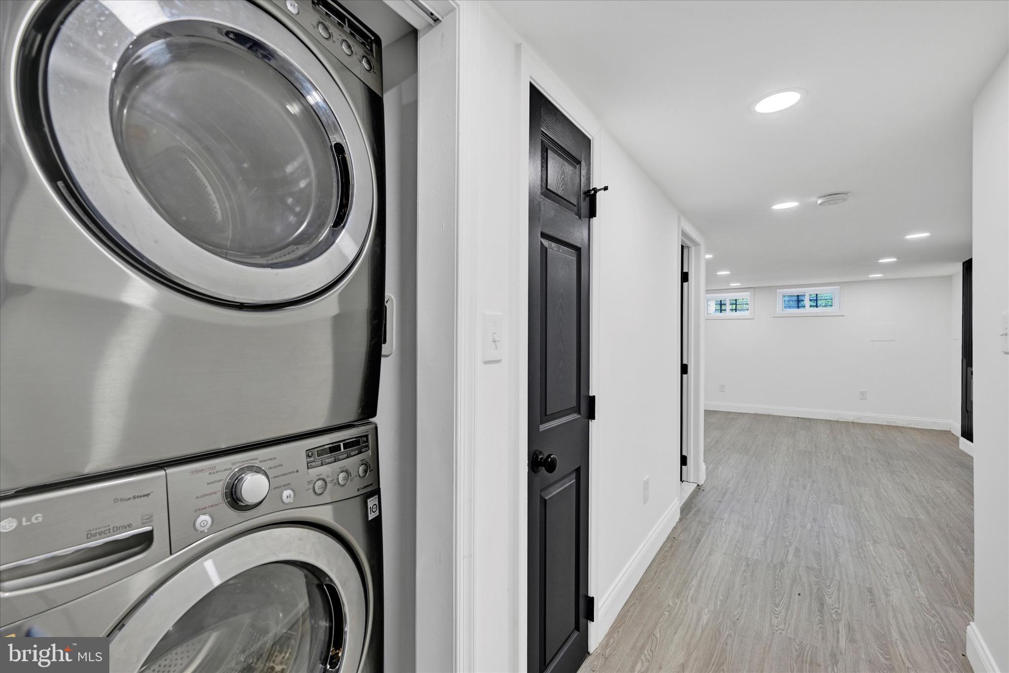 1748 North Chester Street Baltimore, MD 21213 - Photo 23 of 27 a view of a storage & utility room with washer and dryer