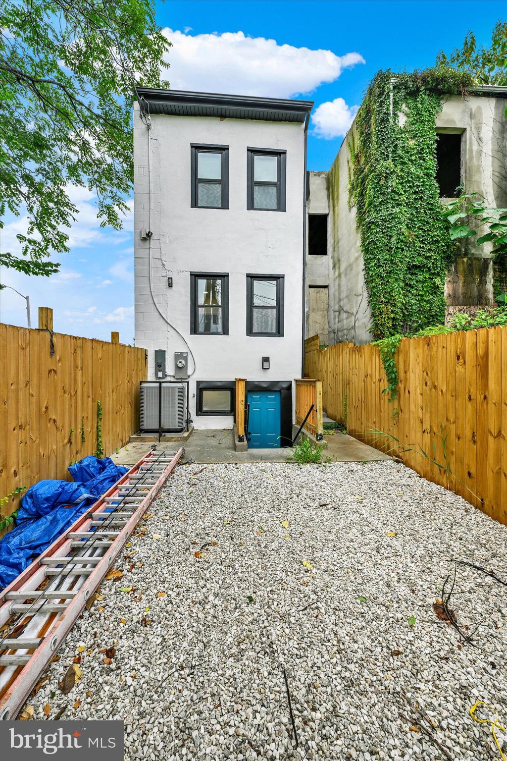 1748 North Chester Street Baltimore, MD 21213 - Photo 25 of 27 a front view of a house with a yard