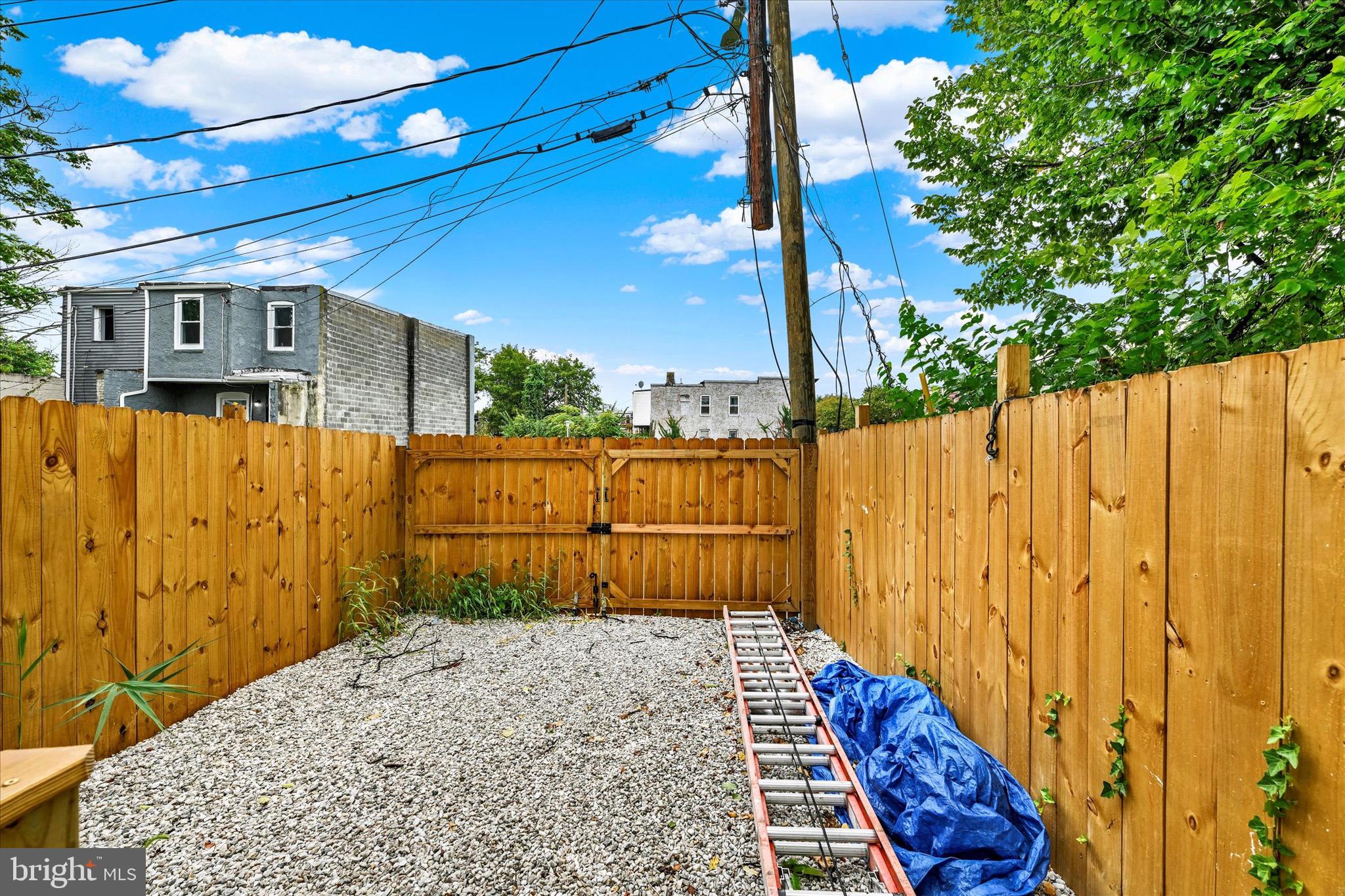 1748 North Chester Street Baltimore, MD 21213 - Photo 27 of 27 a view of a backyard with wooden fence