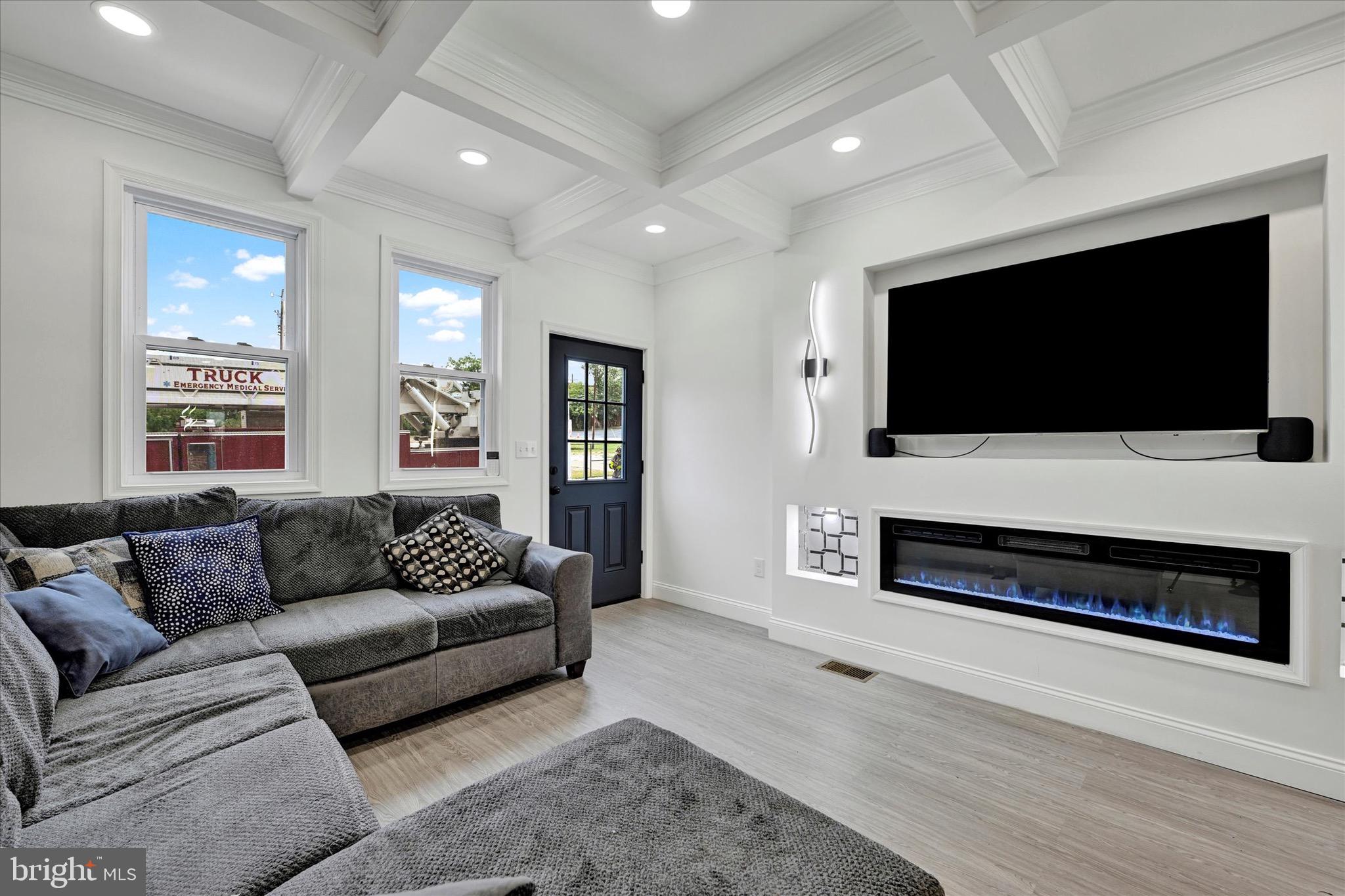 1748 North Chester Street Baltimore, MD 21213 - Photo 4 of 27 a living room with furniture and a flat screen tv