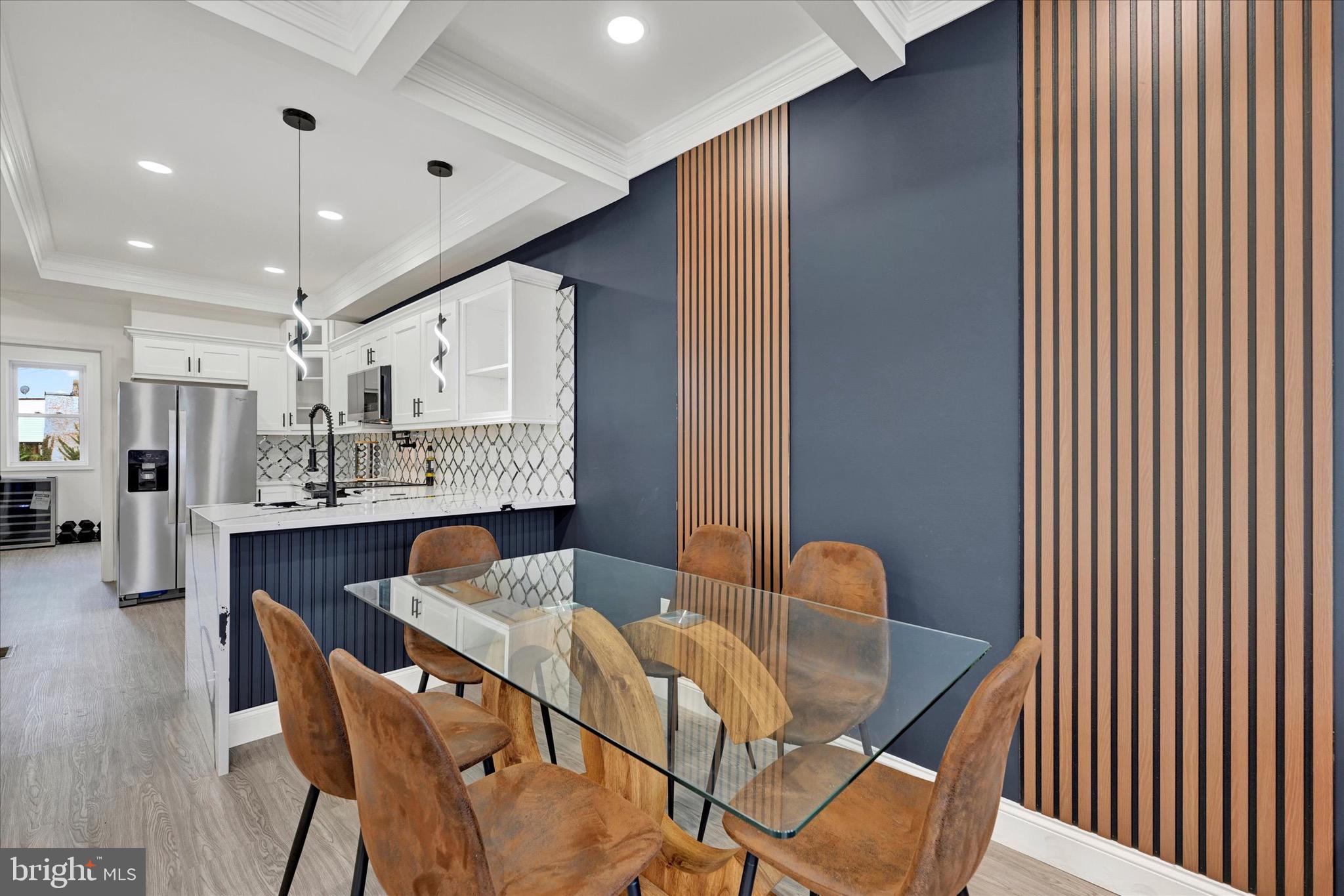 1748 North Chester Street Baltimore, MD 21213 - Photo 6 of 27 a dining room with furniture and window