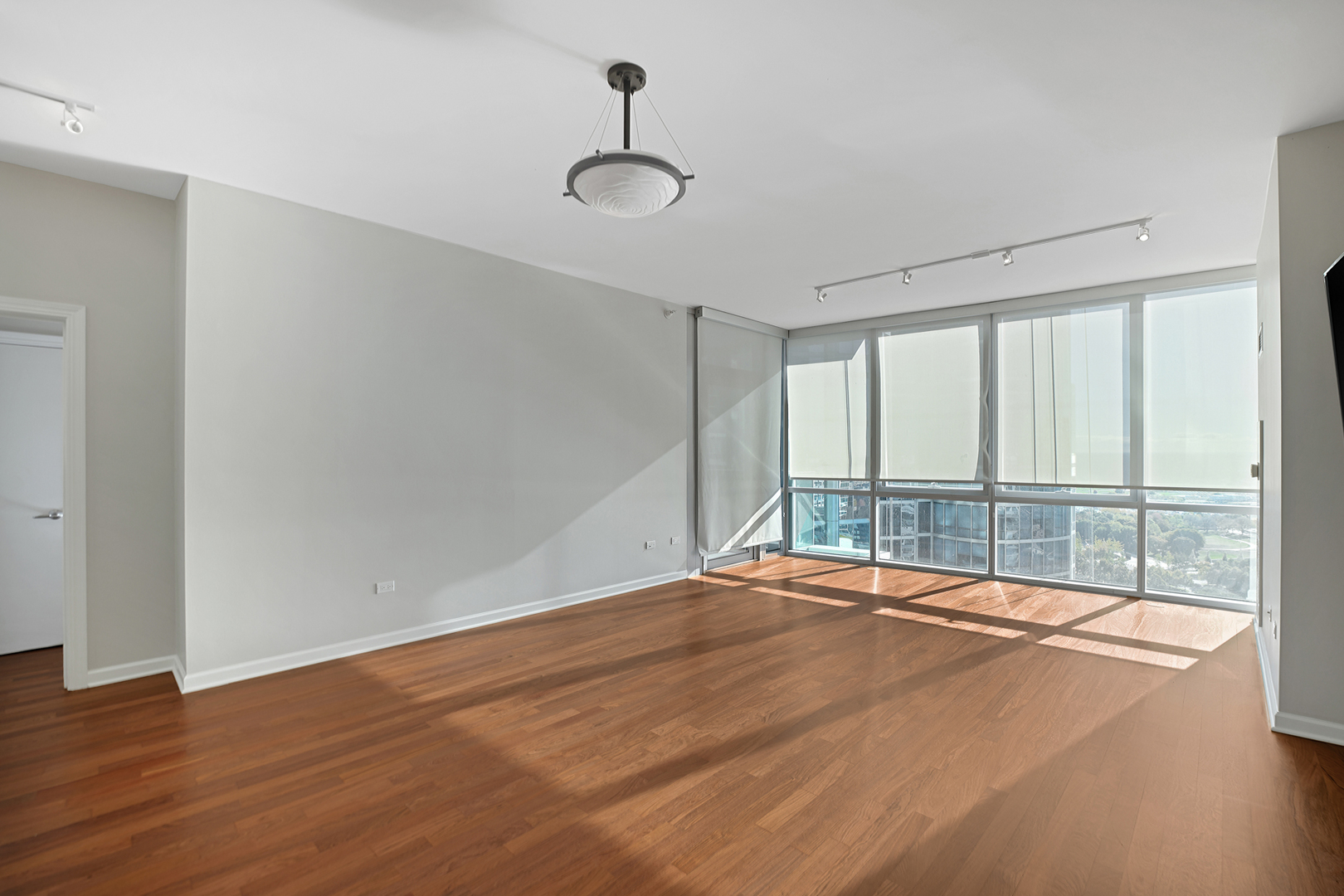 1201 South Prairie Avenue, Unit 2404 Chicago, IL 60605 - Photo 5 of 25 a view of an empty room with a window