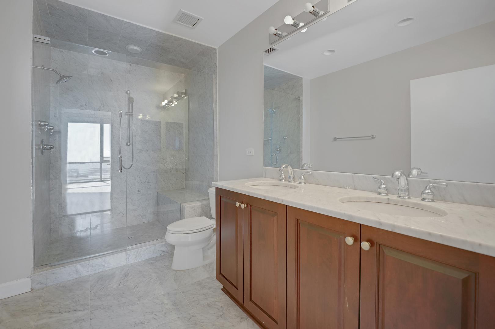 1201 South Prairie Avenue, Unit 2404 Chicago, IL 60605 - Photo 7 of 25 a bathroom with a granite countertop sink toilet and shower