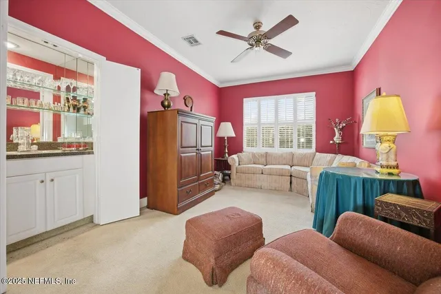 a bedroom with furniture and a window