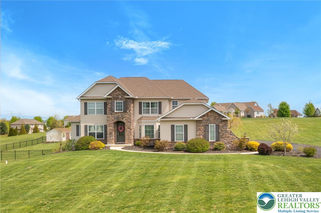 208 East Dell Road Bath, PA 18014 - Photo 1 of 40 a front view of a house with a yard