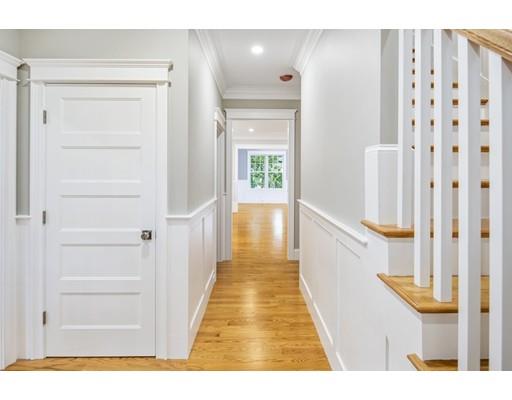 24 Wilson Road Lexington, MA 02421 - Photo 2 of 29 a view of a hallway with wooden floor and staircase