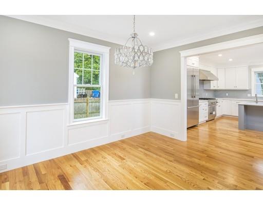 24 Wilson Road Lexington, MA 02421 - Photo 4 of 29 a view of empty room with wooden floor and kitchen view