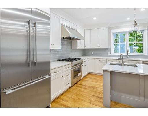 24 Wilson Road Lexington, MA 02421 - Photo 6 of 29 a kitchen with white cabinets and white appliances
