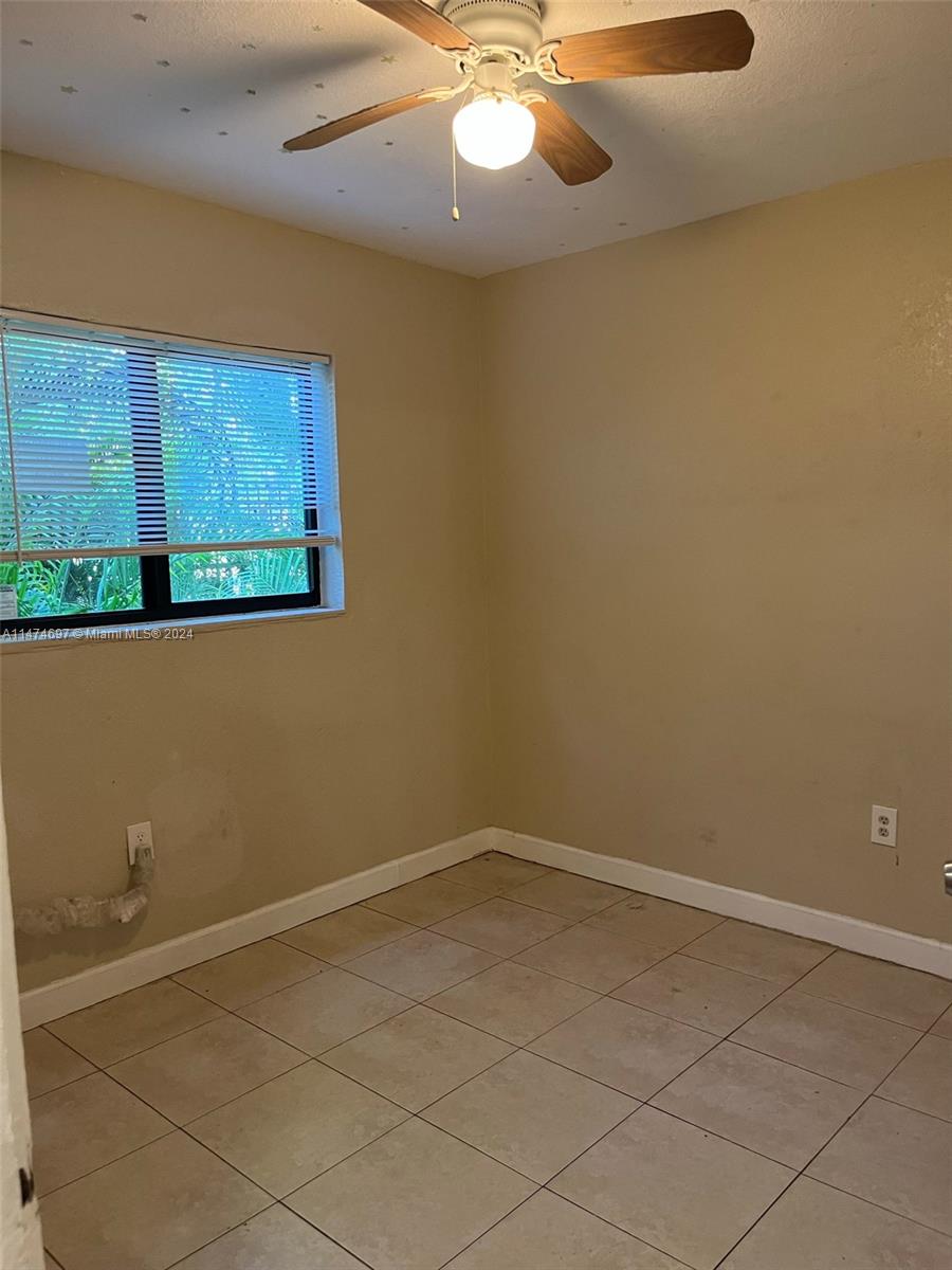 180 Northeast 71st Street, Unit 2 Miami, FL 33138 - Photo 6 of 10 an empty room with a window