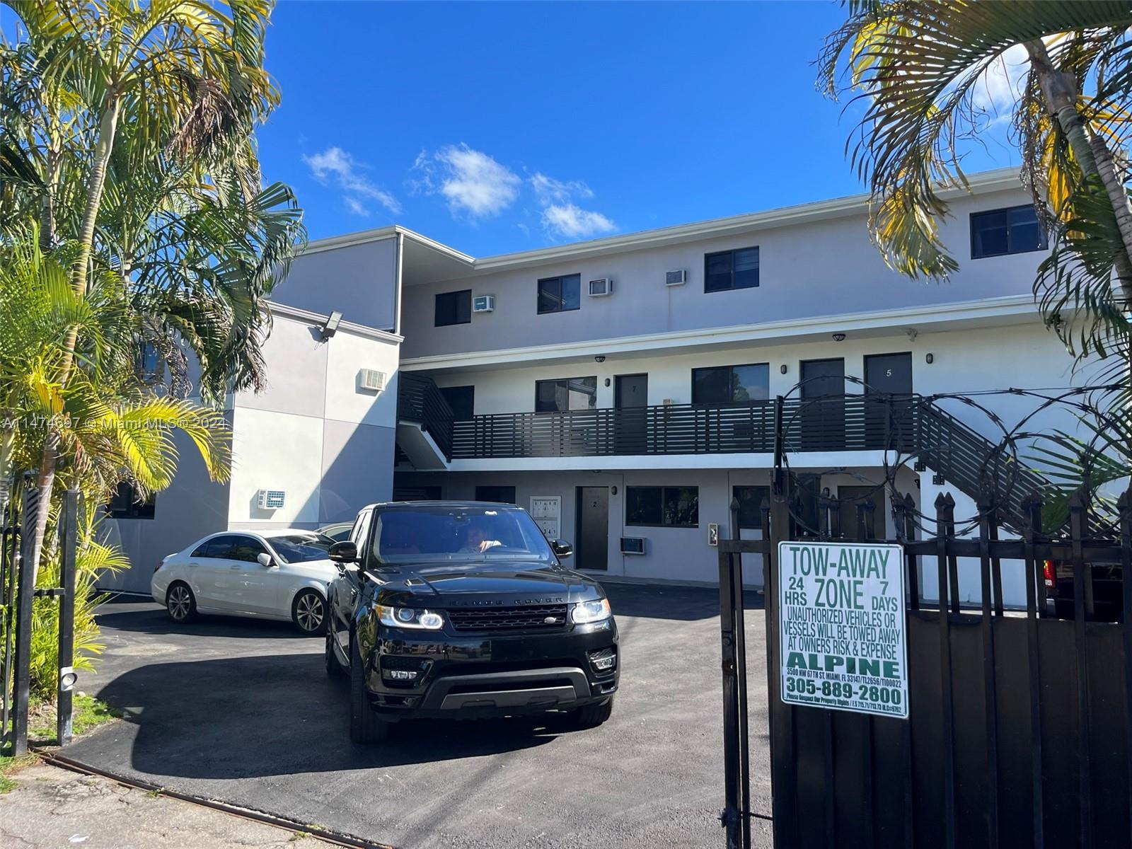 180 Northeast 71st Street, Unit 2 Miami, FL 33138 - Photo 10 of 10 a car parked in front of a building