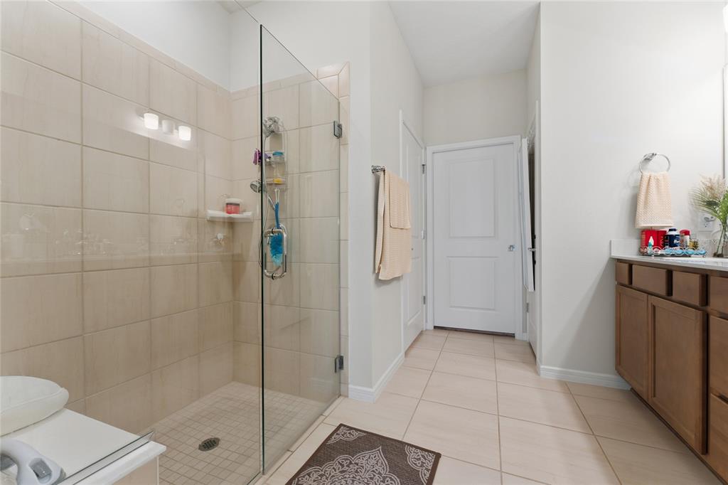 1880 Spring Shower Circle Kissimmee, FL 34744 - Photo 21 of 43 a bathroom with a shower and a toilet