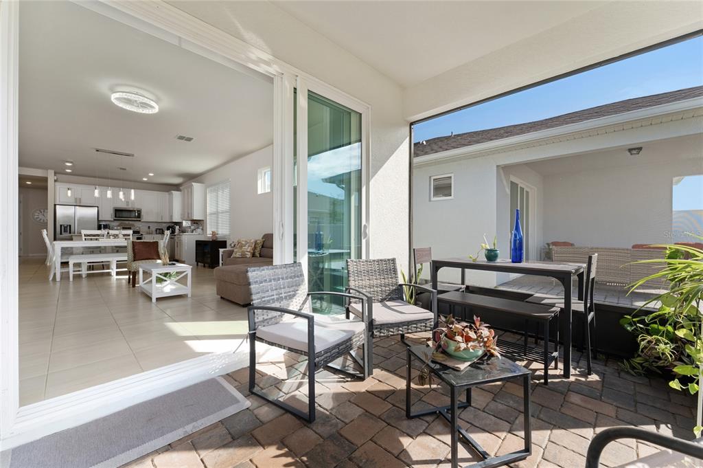 1880 Spring Shower Circle Kissimmee, FL 34744 - Photo 23 of 43 a living room with furniture and a table