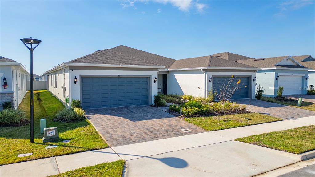 1880 Spring Shower Circle Kissimmee, FL 34744 - Photo 5 of 43 a front view of a house with garden