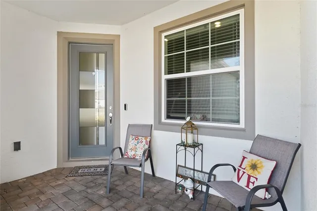 a view of a room with furniture and windows