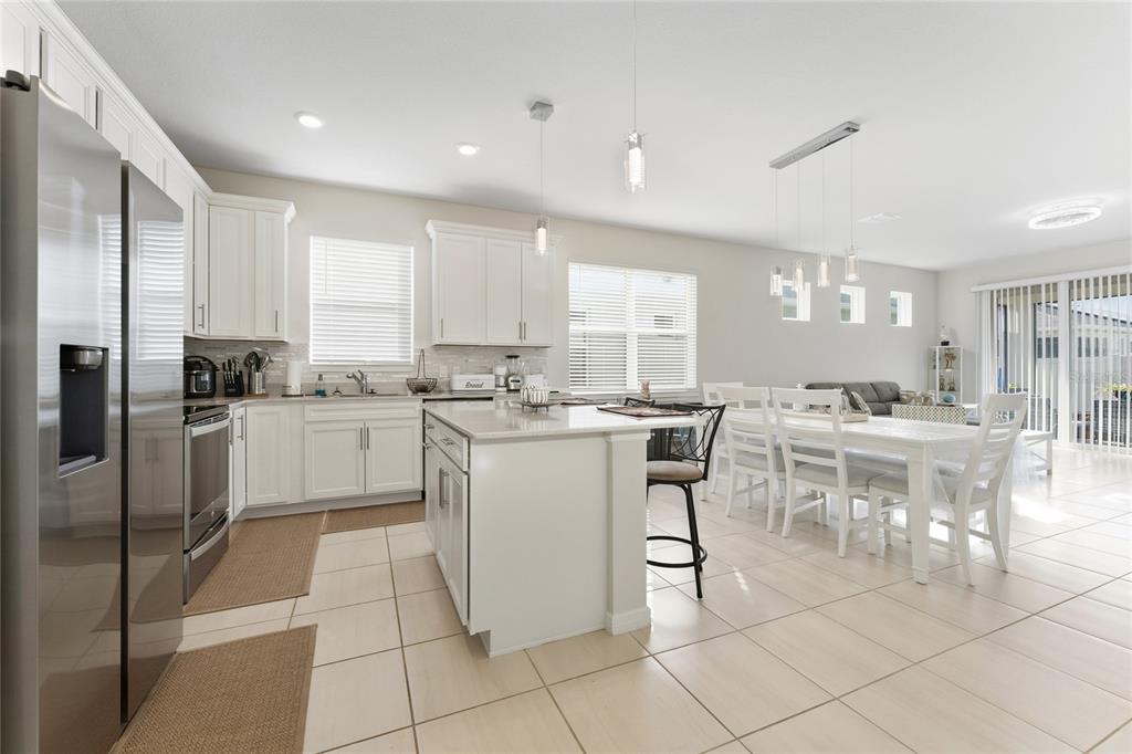 1880 Spring Shower Circle Kissimmee, FL 34744 - Photo 9 of 43 a kitchen with a sink window and cabinets