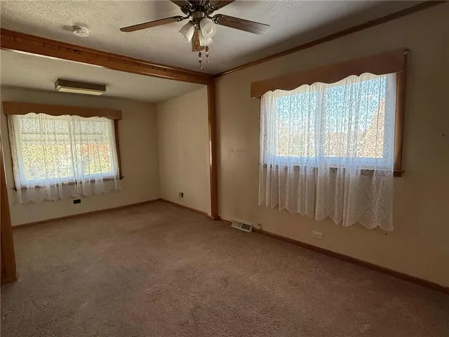 an empty room with windows