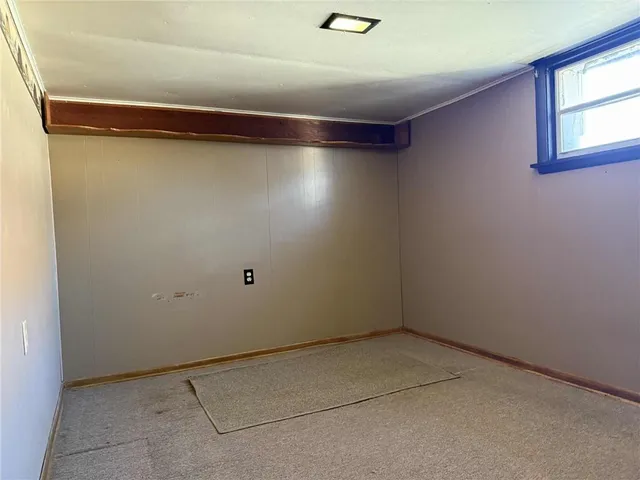 an empty room with a empty space and windows