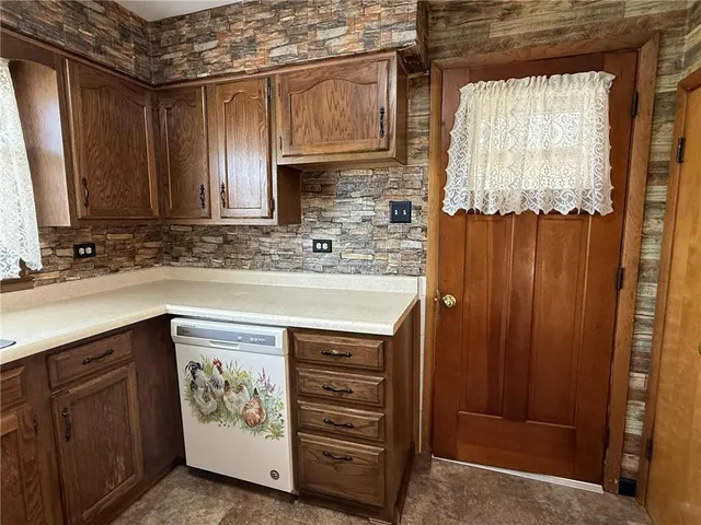 a view of a dining room with furniture and window
