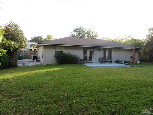 a backyard of a house with lots of green space