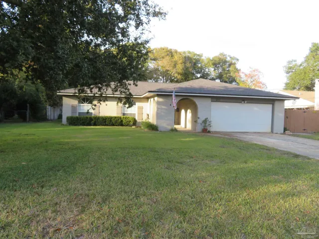 a stove top oven sitting inside of a kitchen