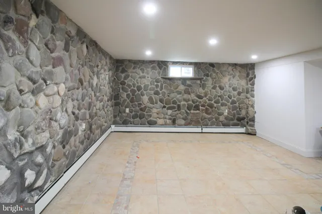 a bathroom with a bathtub and shower