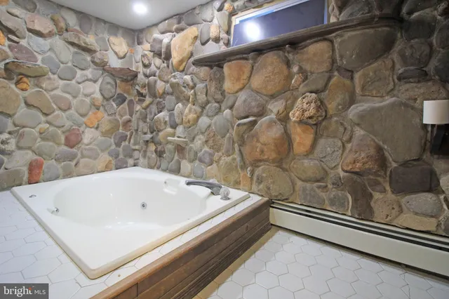 a kitchen with a sink a stove and cabinets