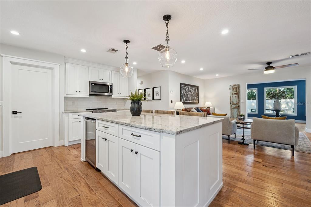 2609 Summerfield Road Winter Park, FL 32792 - Photo 13 of 40 a kitchen with kitchen island granite countertop a sink counter top space and stainless steel appliances