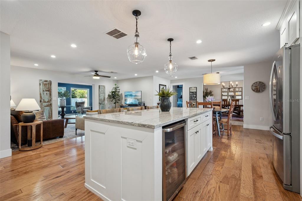 2609 Summerfield Road Winter Park, FL 32792 - Photo 15 of 40 a kitchen with stainless steel appliances granite countertop a lot of counter top space and wooden floor