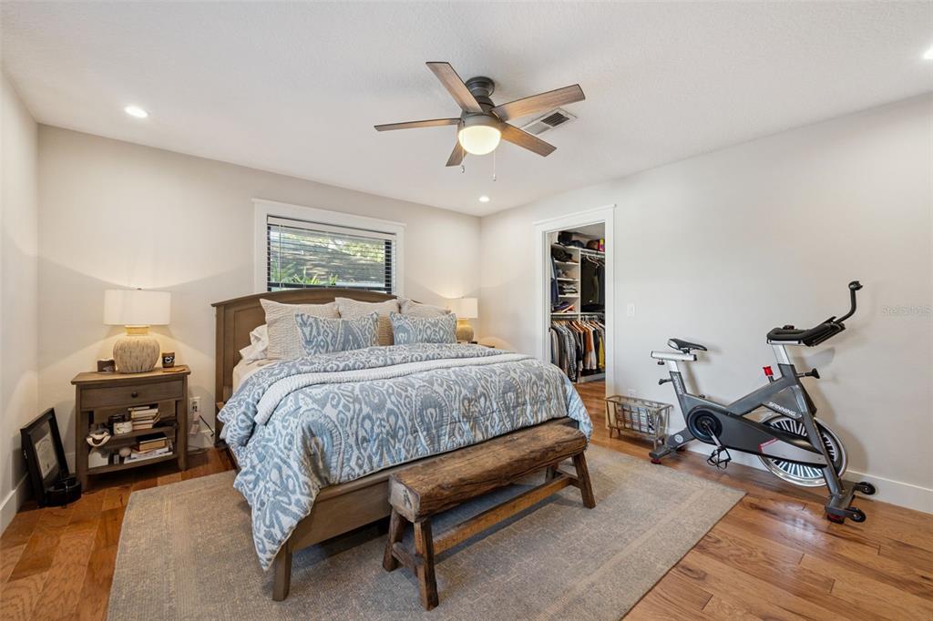 2609 Summerfield Road Winter Park, FL 32792 - Photo 18 of 40 a bedroom with a bed and a chandelier