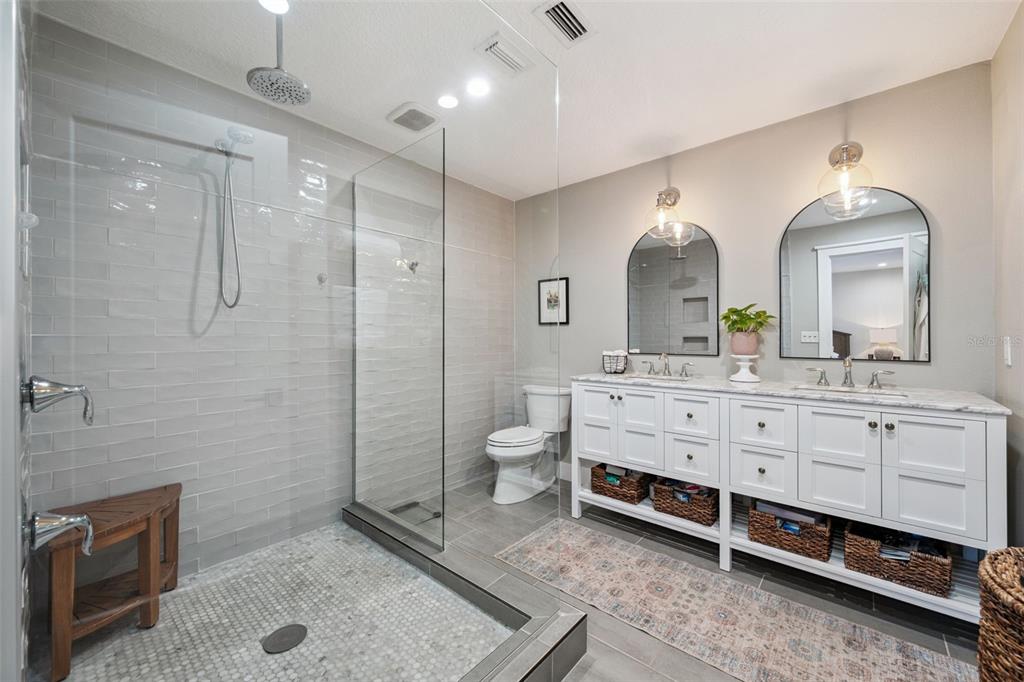 2609 Summerfield Road Winter Park, FL 32792 - Photo 21 of 40 a bathroom with a double vanity sink a toilet and a mirror
