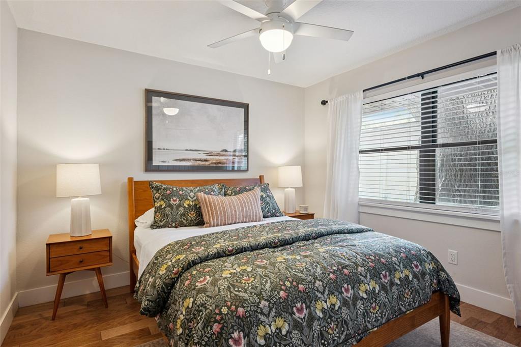 2609 Summerfield Road Winter Park, FL 32792 - Photo 24 of 40 a bedroom with a large bed and a chair