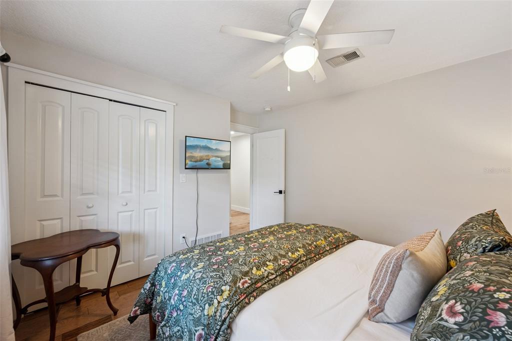 2609 Summerfield Road Winter Park, FL 32792 - Photo 25 of 40 a bedroom with a bed and a chair