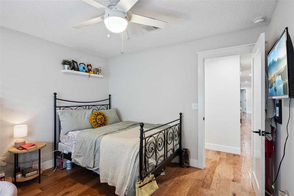 2609 Summerfield Road Winter Park, FL 32792 - Photo 26 of 40 a bedroom with a bed and a chandelier