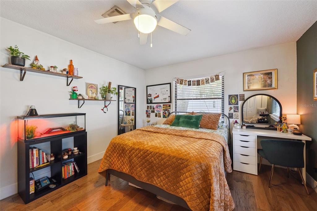 2609 Summerfield Road Winter Park, FL 32792 - Photo 28 of 40 a bed room with a bed and a book shelf