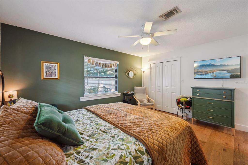 2609 Summerfield Road Winter Park, FL 32792 - Photo 29 of 40 a bedroom with a large bed and a chandelier