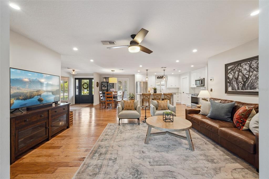 2609 Summerfield Road Winter Park, FL 32792 - Photo 8 of 40 a living room with furniture kitchen view and a large window